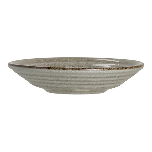 A round, shallow porcelain coupe plate with a subtle textured design and a neutral, earthy glaze.