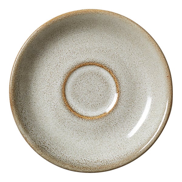 A round, speckled porcelain saucer with a slightly raised center ring, measuring 5 inches in diameter.