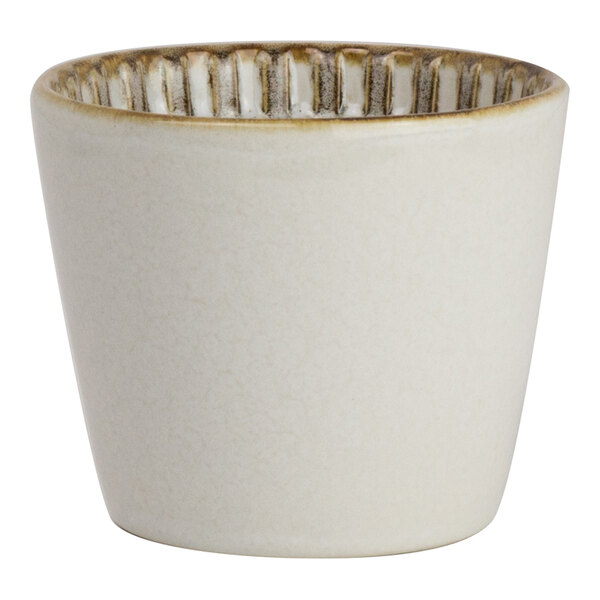 A round, birch-colored porcelain fry cup with a textured rim, holding 8 oz.