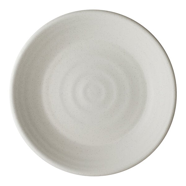 A round, white porcelain bowl with a subtle textured pattern.