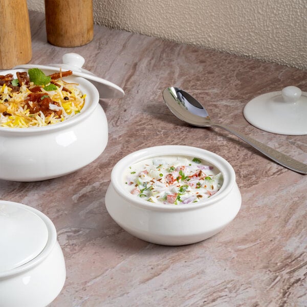 A round ivory porcelain soup bowl with a lid.