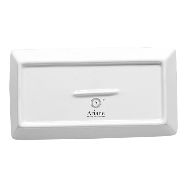 A rectangular white porcelain lid with a small handle in the center and the brand name 'Ariane' printed on it.