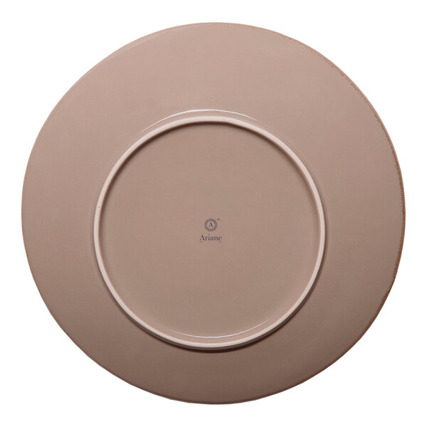 A round beige porcelain coupe flat plate with a slanted edge.