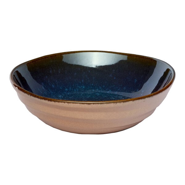 A round blue porcelain coupe bowl with a glossy interior and matte exterior finish.