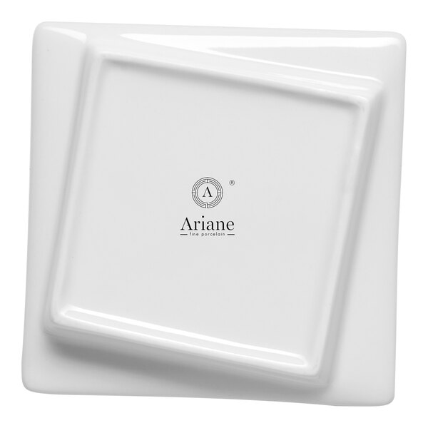 A white square porcelain plate with an asymmetric rim and the Ariane logo in the center.