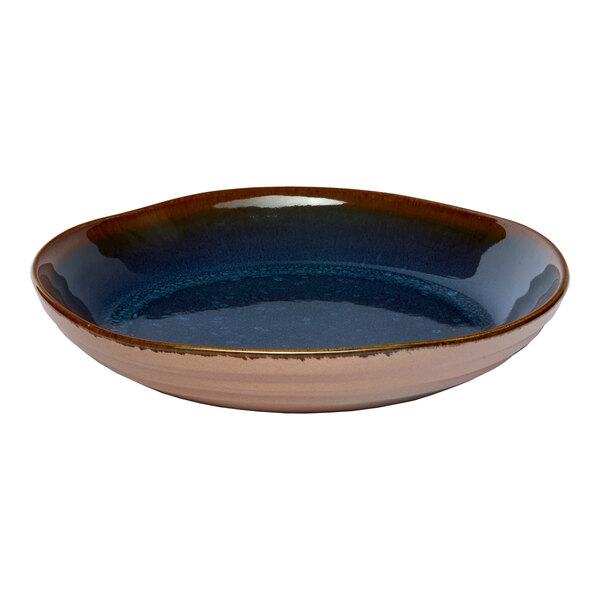 A round blue porcelain coupe bowl with a glossy finish.