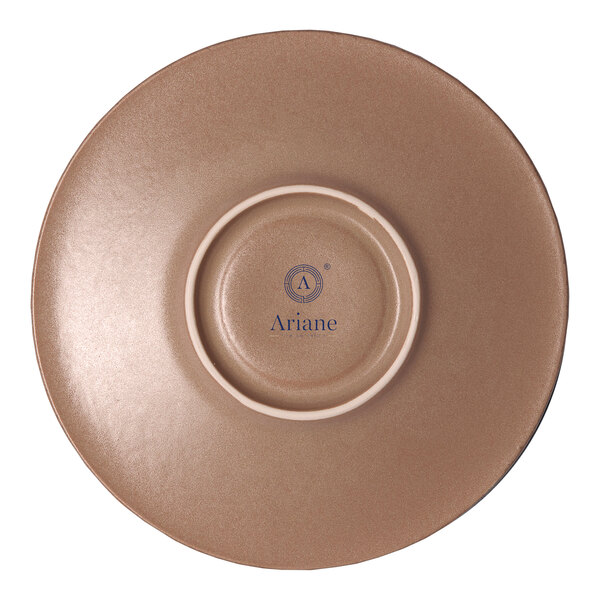A round, brown porcelain coupe saucer with the Ariane logo on the bottom.