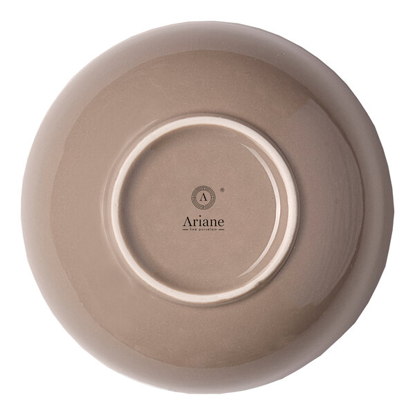A beige round porcelain coupe bowl shown upside down with the Ariane logo on the bottom.