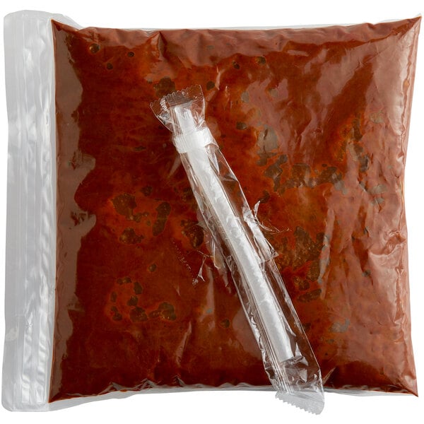 A white plastic bag of Advanced Food Products Premium Chili Sauce with a tube on it.
