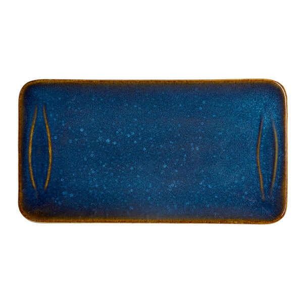 A blue rectangular porcelain platter with a speckled finish and rounded edges.