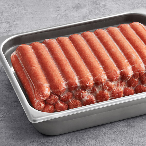 A stainless steel tray filled with individually wrapped skinless beef franks.