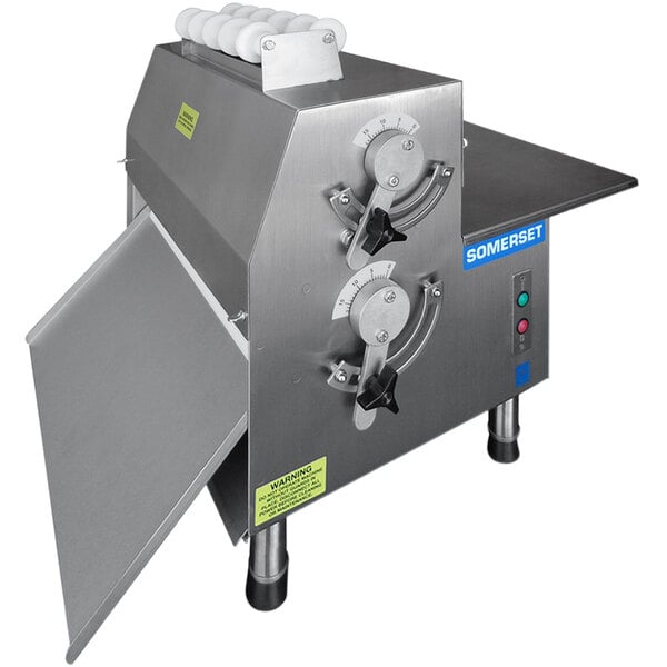 A stainless steel countertop dough sheeter with two adjustment dials and a side-operated design, labeled Somerset.