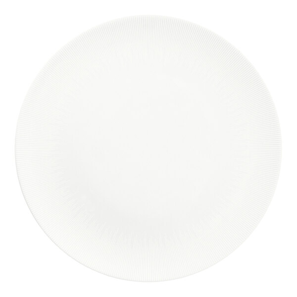 A bright white round flat porcelain coupe plate with a subtle textured rim.