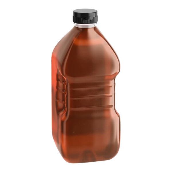 A large plastic bottle filled with hot honey and sealed with a black cap.