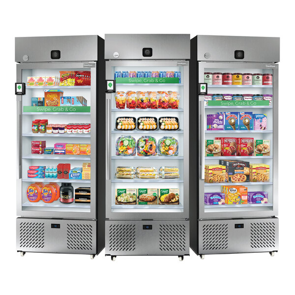 A set of three refrigerated vending microstores stocked with various food and beverage items.