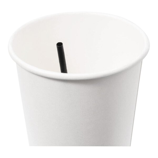 A plain white paper cup with a short black stirrer straw inside.