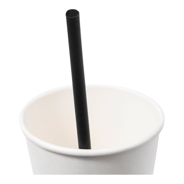 A black agave giant straw placed inside a white cup.