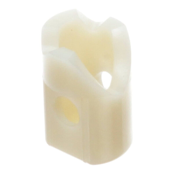 A white plastic bushing for a lift-off hinge, used in Continental Refrigerator equipment.