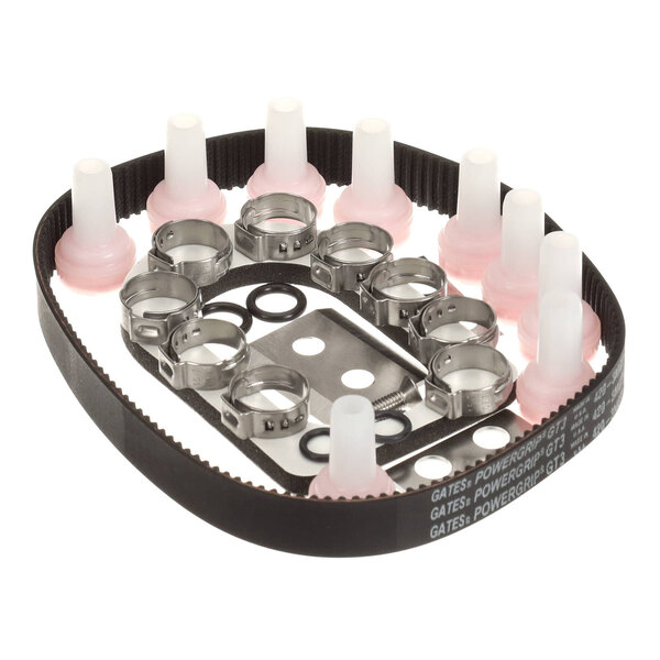 A kit containing various mechanical parts including a timing belt, hose clamps, gaskets, and plastic fittings.