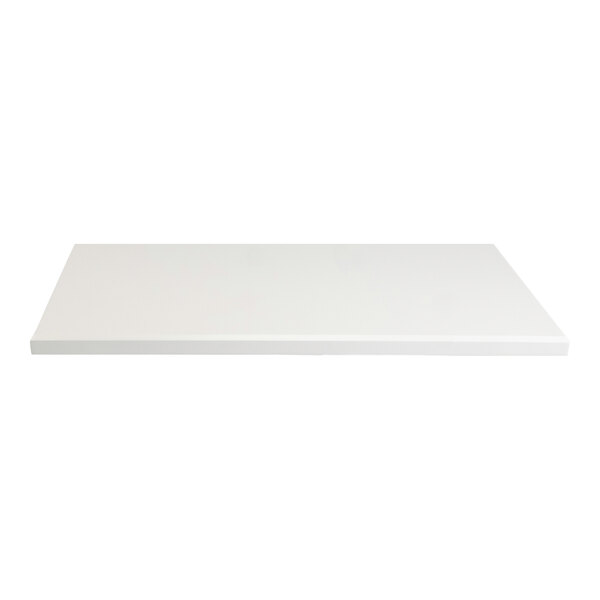 A rectangular white indoor table top with eased edges and squared corners.
