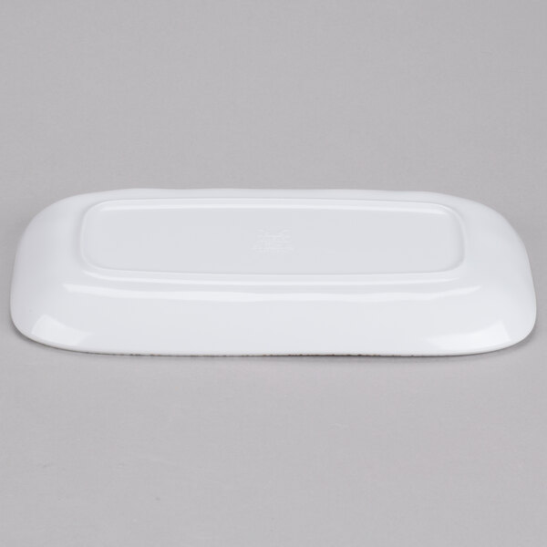 A white, irregular rectangular melamine platter shown upside down.