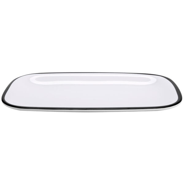 A white rectangular melamine dinner platter with black trim.
