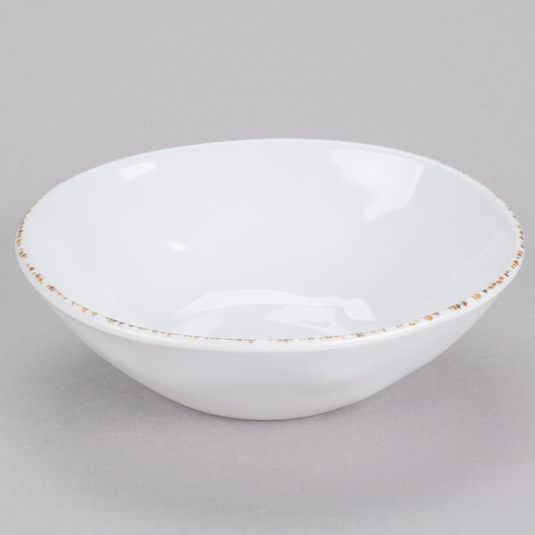 A white melamine bowl with an irregular shape and a subtle decorative rim.
