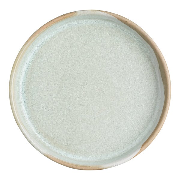 A round stoneware bowl with a light, natural finish and slightly raised rim.
