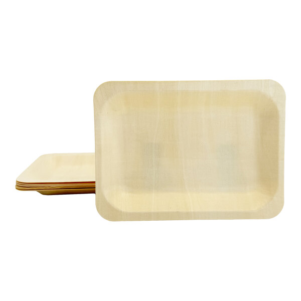 A stack of rectangular birch wood plates with rounded corners.