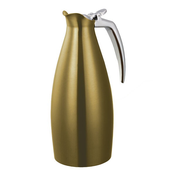 A vintage gold stainless steel insulated coffee carafe server with a silver handle.