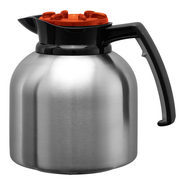 A stainless steel coffee server with a black handle and an orange brew-thru lid.