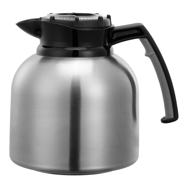 A stainless steel coffee server with a black handle and an orange clock lid.