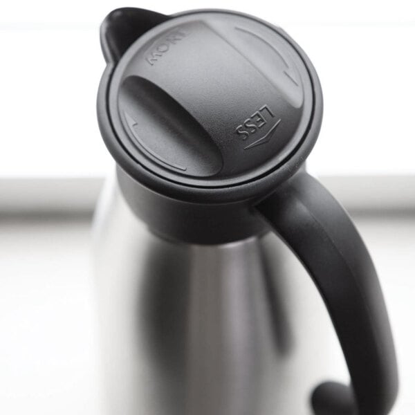 A stainless steel coffee carafe with a black plastic lid and handle.
