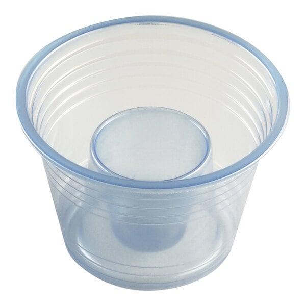 A clear blue plastic bomb shot cup with a smaller inner chamber for separating liquids.