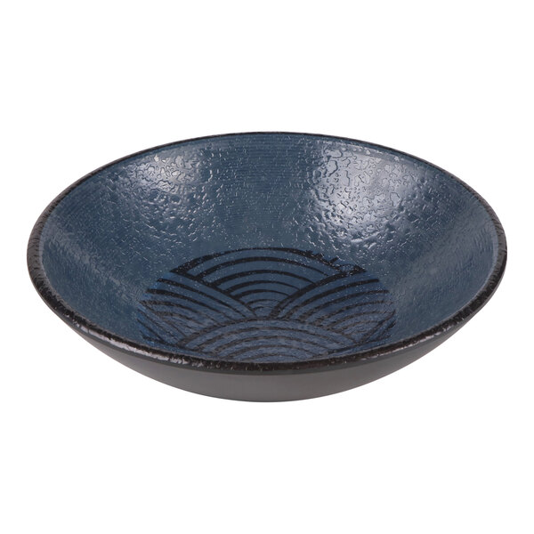 A dark blue coupe bowl with a textured interior and a geometric pattern, designed to hold 20 oz.