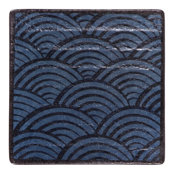 A square dark blue melamine plate with a repeating wave pattern.