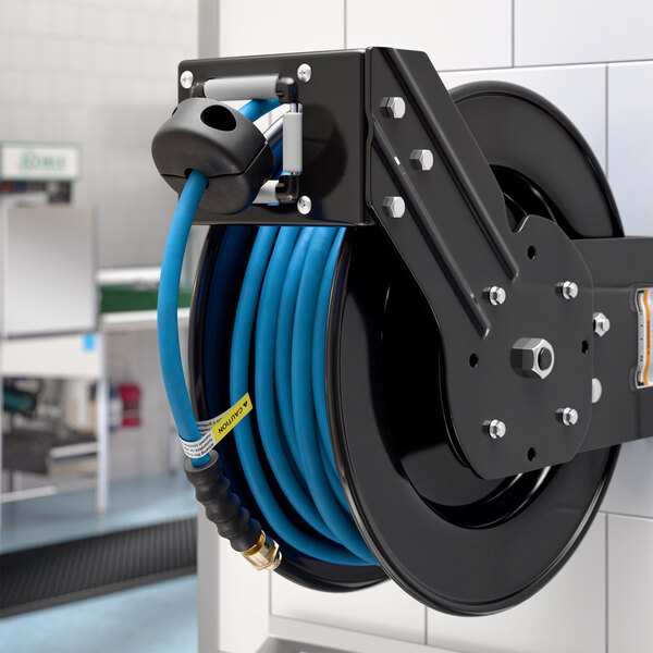 A black powder-coated steel air hose reel with a 50-foot blue hose mounted on a wall.