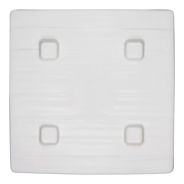 A square light blue melamine plate with four small indented squares, designed for serving food.