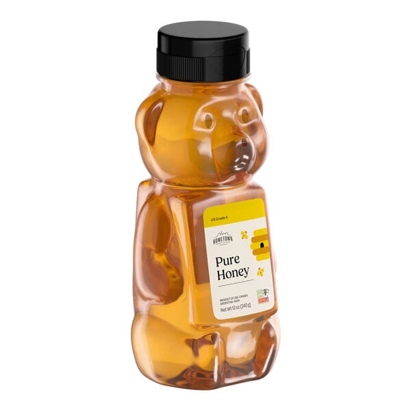 A 12-ounce bear-shaped squeeze bottle filled with all-natural amber honey.