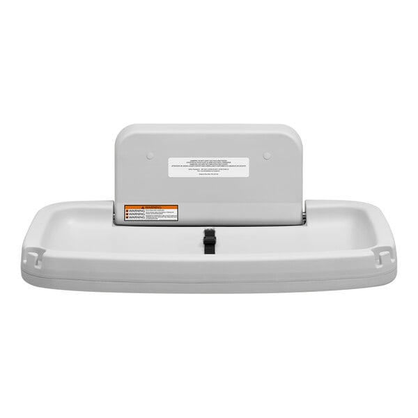 A gray horizontal surface-mounted baby changing station.