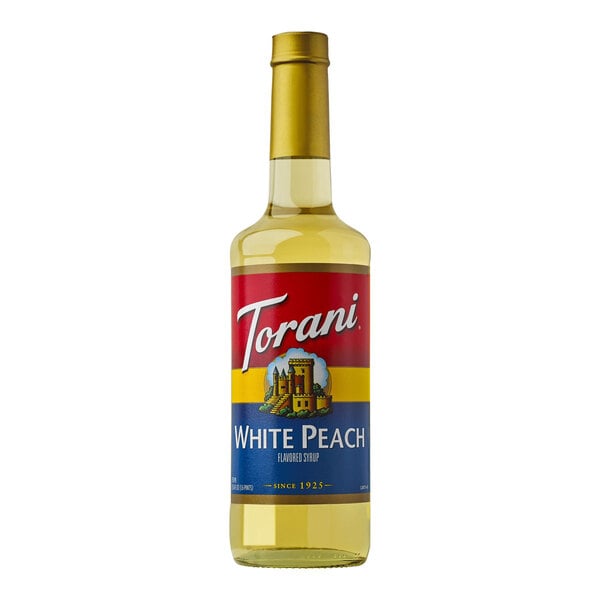 A 750 mL glass bottle of Torani White Peach flavored syrup.
