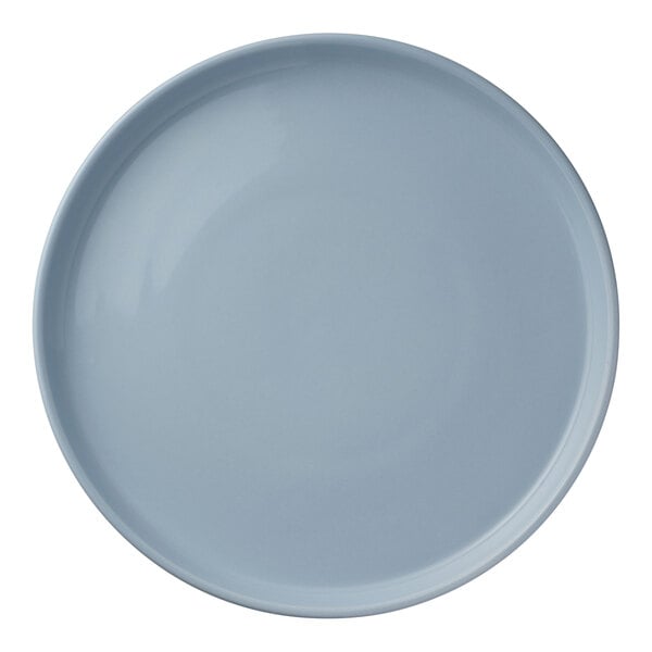 A round, light blue porcelain plate.