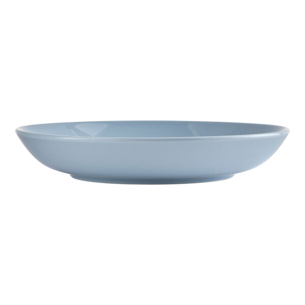 A light blue round low porcelain bowl.