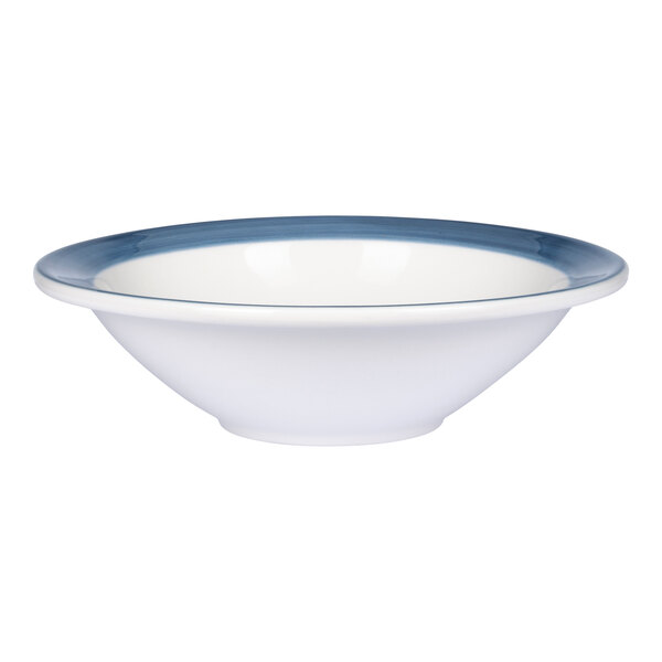 A white porcelain bowl with a blue band around the rim.