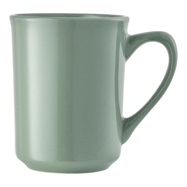A green porcelain mug with a handle.