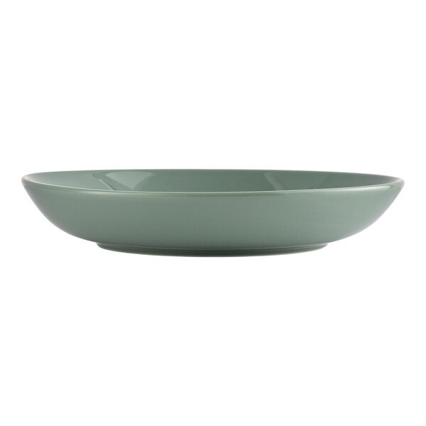 A round, low, moss-colored porcelain bowl.
