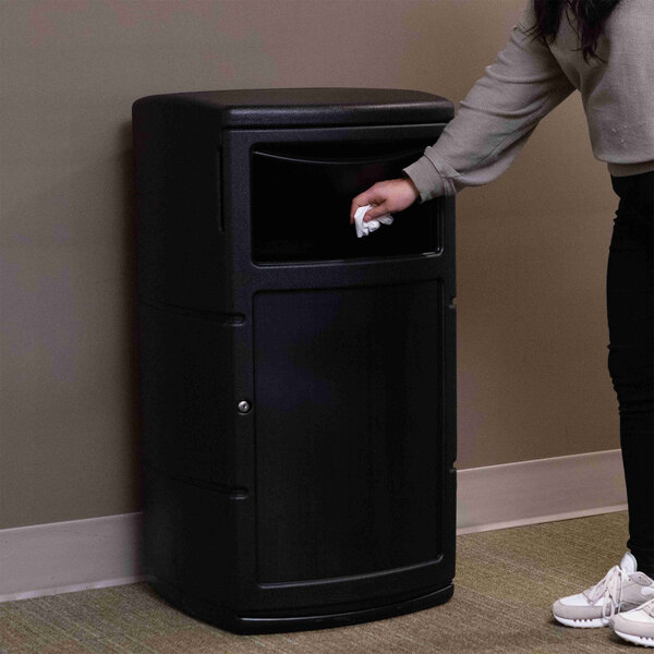 A black 25-gallon square trash can with a dual-flipper dome lid and side entry opening.
