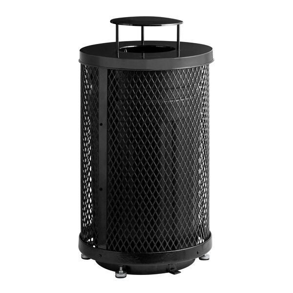 A large, round, black outdoor trash can made of expanded steel with a rain bonnet lid.