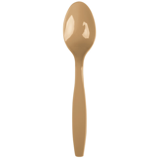 A gold-colored heavy weight plastic spoon.