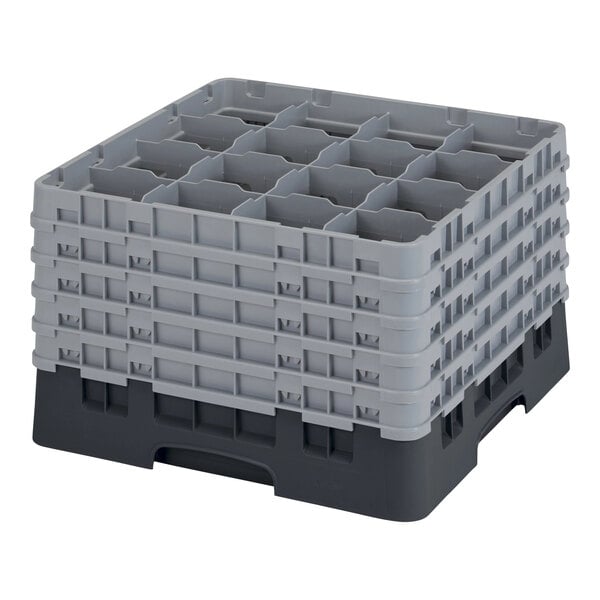 A grey plastic Cambro glass rack with 16 compartments and black extenders.
